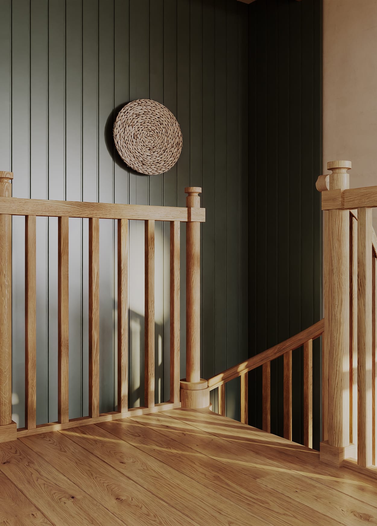 Carpenter spiral staircase landing detail with oak post and spindle railing