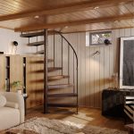 Half Turn spiral staircase in a bronze finish inside a wood-paneled den with a loft