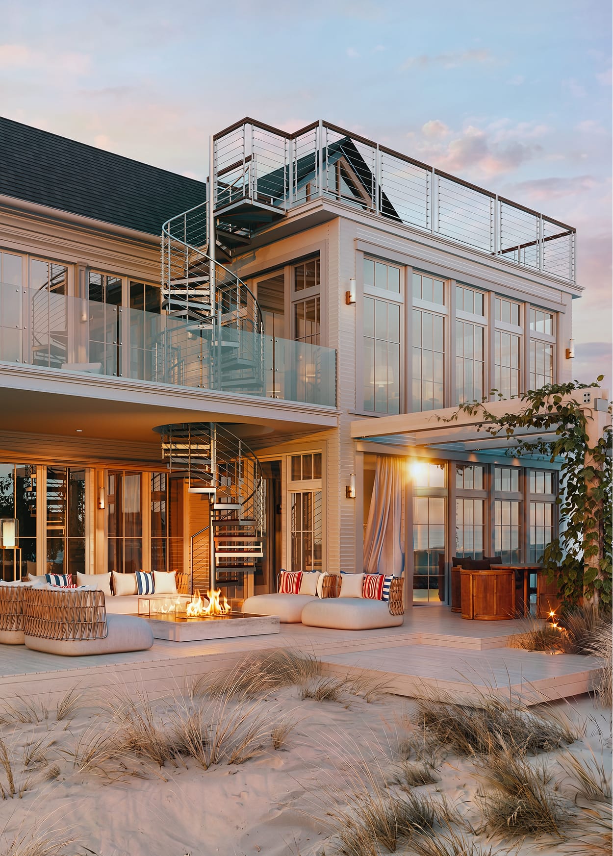 Multi-Line spiral staircase on a coastal home exterior, connecting a patio to a rooftop deck at dusk