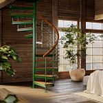 Multi-Line spiral staircase in a green painted finish inside a rustic wood-paneled loft
