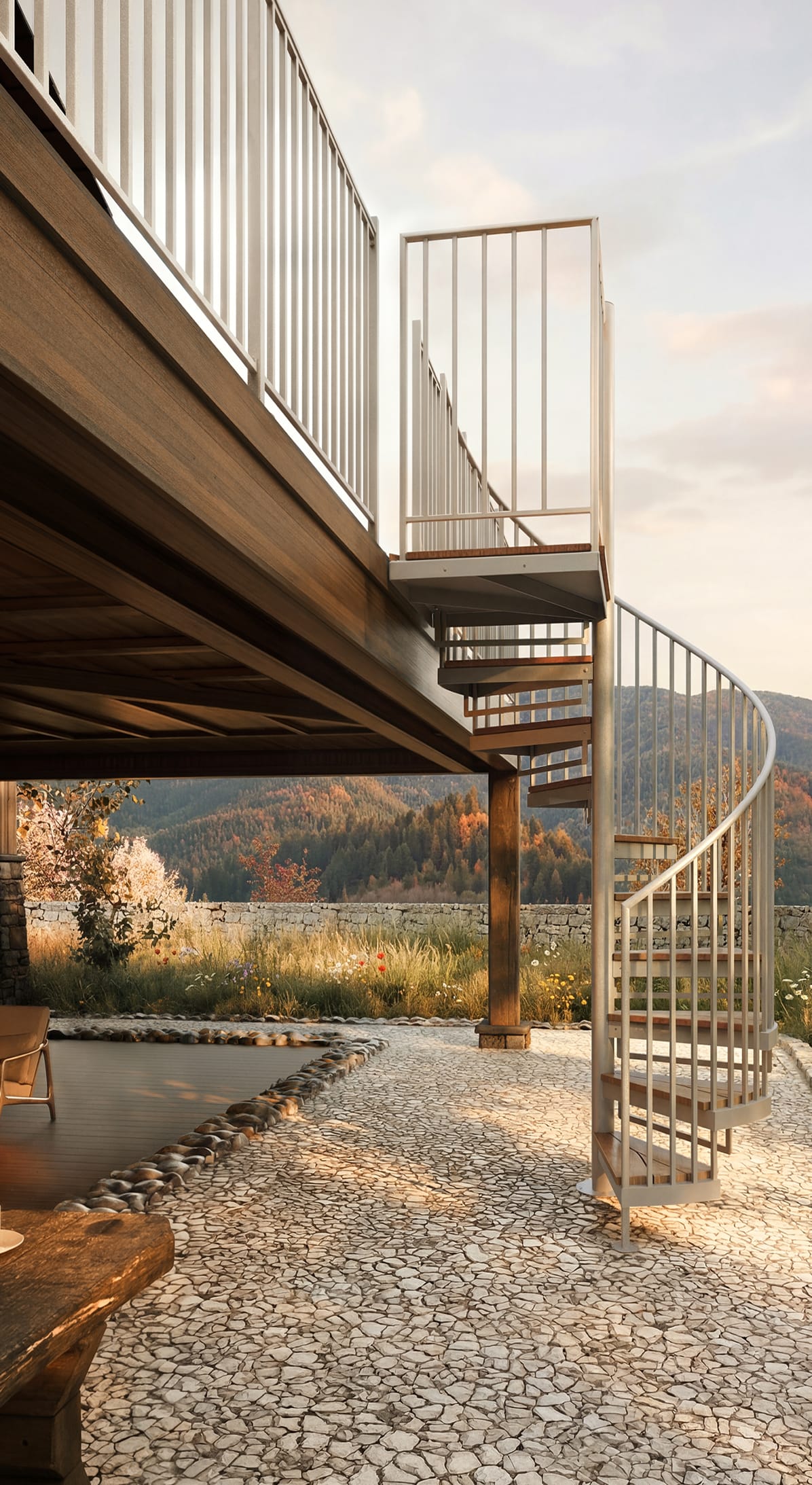 Outdoor spiral staircase in a white finish with wood treads, mountain view in the background