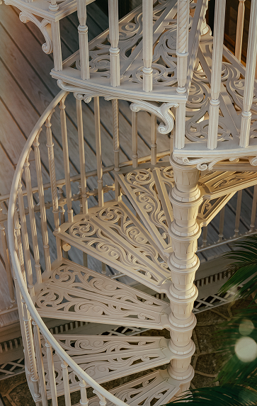 Victorian spiral staircase tread with open filigree scrollwork pattern
